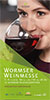 Flyer für die Wormser Weinmesse, Frau nippt an einem Rotwein (Bild angeschnitten), davor von oben nach rechts unten führende überlappende Grünflächen mit Texten