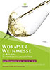Plakat Wormser Weinmesse 2015, gekipptes Weinglas, in das Weisswein eingegossen wird. Darunter schräge, grüne Flächen mit Plakattexten in Weiß